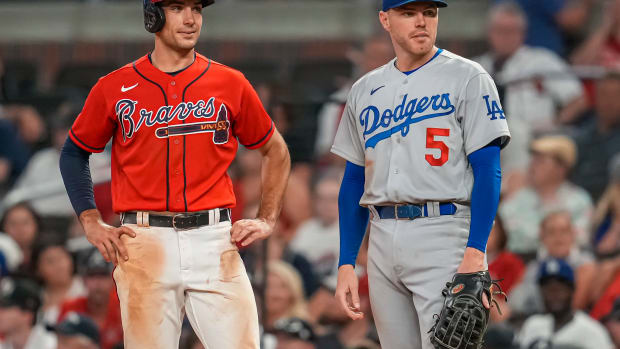 Jun 24, 2022; Cumberland, Georgia, USA; Atlanta Braves first baseman Matt Olson (28) on base next to Los Angeles Dodgers first baseman Freddie Freeman (5) during the ninth inning at Truist Park.